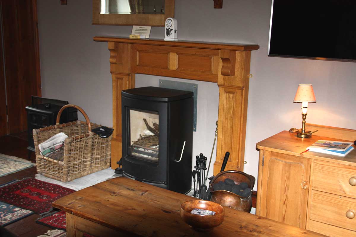 Cosy traditional living room with wood burning stove 